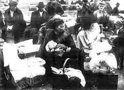 Italian emigration history: Italians emigrants waiting for the ship in the port of Naples