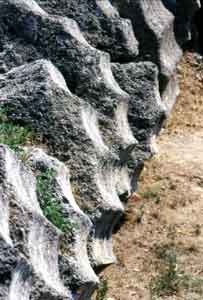 Mediterranean Photographyc Yachting: Mediterranean Archaeology: Doric column fragment in Olympia; Photography by Francesco Saverio ALESSIO &copy; copyright 1998